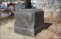 Carved block of dark Penryn granite located at the back of the Griffith Quarry Museum, Penryn, CA