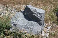 Piece of granite near entrance to Rosemary's Mountain Quarry, San Diego Co., CA