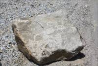 Piece of granite near entrance to Rosemary's Mountain Quarry, San Diego Co., CA