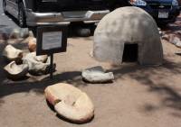 Replica of an &rsquo;ewaa hut, and stone mortars, San Diego Mission, San Diego, CA