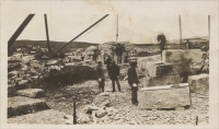 Men cutting blocks of stone in Quarry (location unknown; postcard photograph)