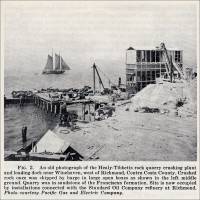 An old photograph of the Healy-Tibbets rock quarry crushing plant and loading dock near Winehaven, west of Richmond, Contra Costa County