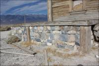 Base of building displaying dolomites of many colors quarried from the old Inyo Marble Co. / present-day F.W. Aggregates Quarries 