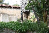 Bronze statue of a Spanish missionary priest in the Santa Barbara Mission Cemetery, CA