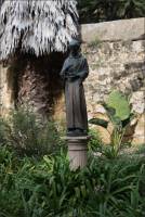 Bronze statue of a Spanish missionary priest in the Santa Barbara Mission Cemetery, CA