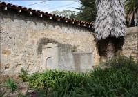 Sandstone and mortar wall and mausoleums in the Santa Barbara Mission Cemetery, CA