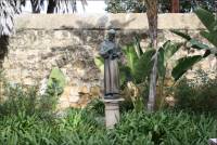 Bronze statue of a Spanish missionary priest in the Santa Barbara Mission Cemetery, CA